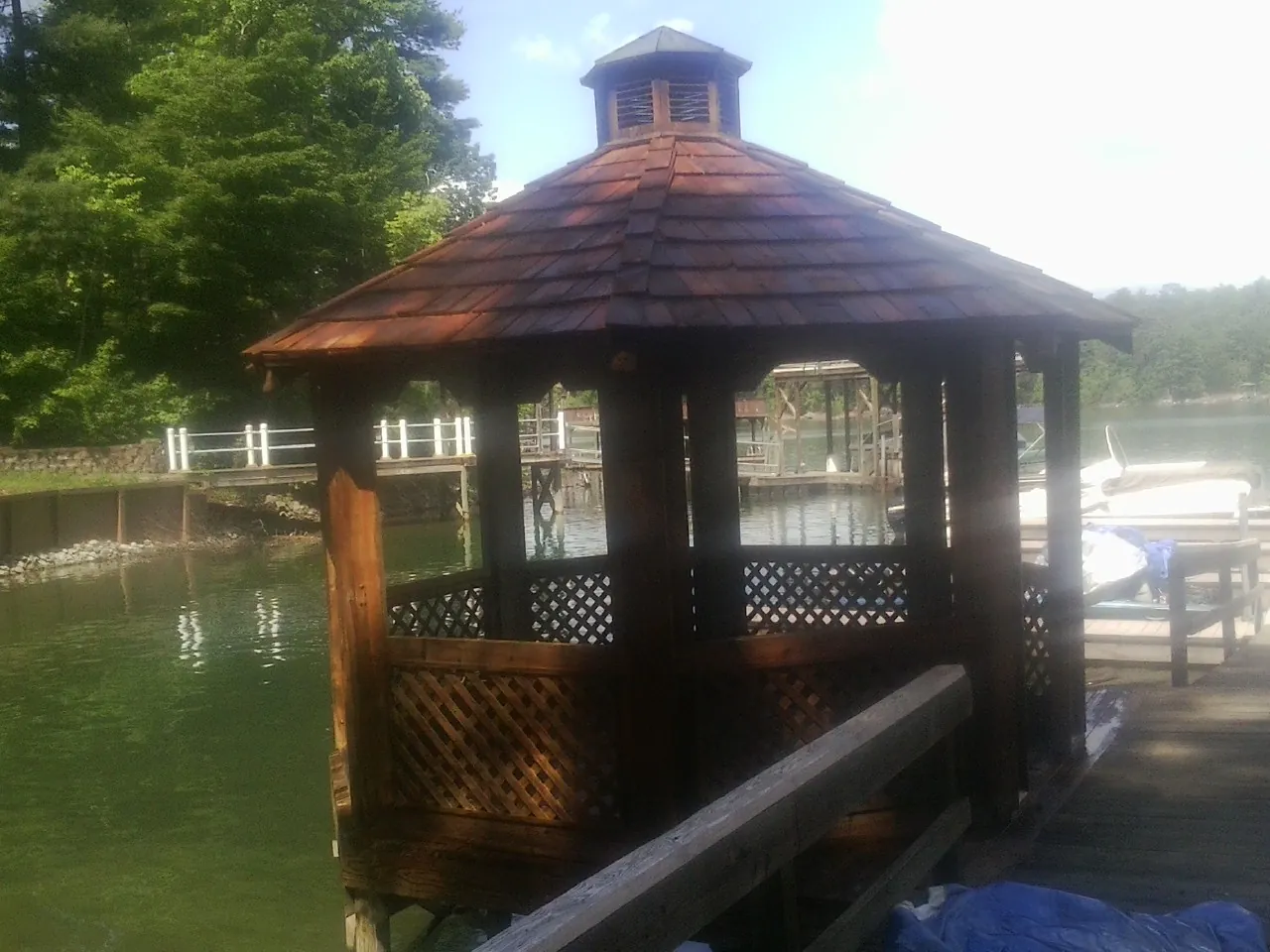 Cedar shake gazebo roof rebuilt on a lake dock in Harrison
